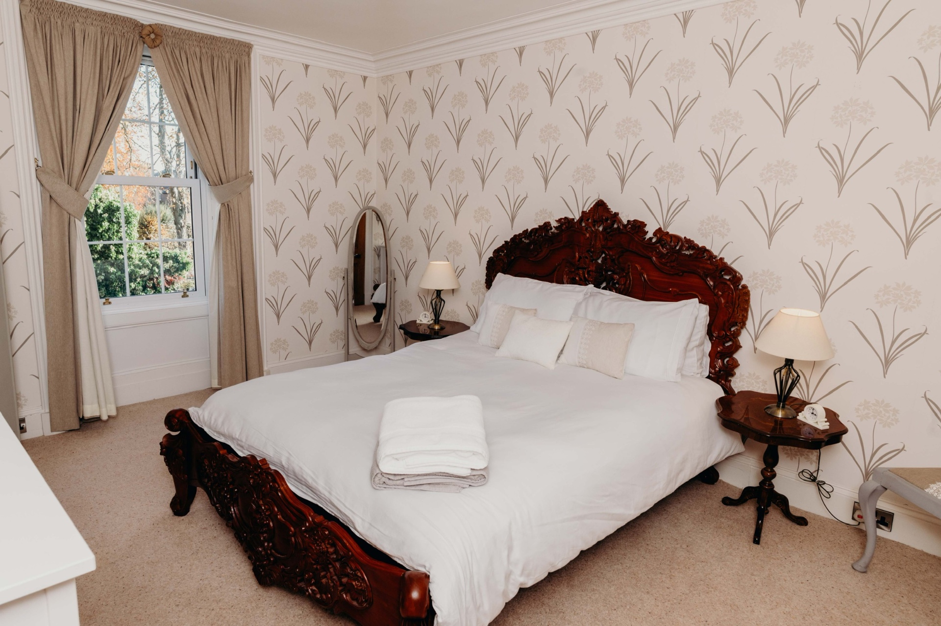 Carved four-poster bedroom